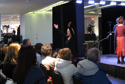 Diane Labrosse directing the audience during the concert of the choir Chorale Joker [Photograph: Céline Côté, Montréal (Québec), March 1, 2013]